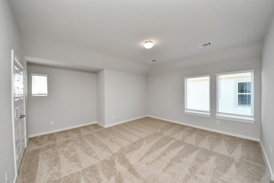 Come upstairs and enjoy a day of leisure in this fabulous game room! This is the perfect hangout spot or adult game room! Features plush carpet, high ceilings, custom paint and windows for plenty of natural light. Sample photo of completed home with similar floor plan. Actual colors and selections may vary. Come upstairs and enjoy a day of leisure in this fabulous game room! This is the perfect hangout spot or adult game room! Features plush carpet, high ceilings, custom paint and windows for plenty of natural light. Sample photo of completed home with similar floor plan. Actual colors and selections may vary.