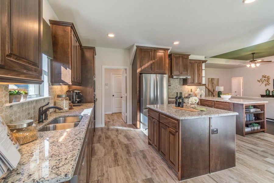 Kitchen | Concept 2379 at Abe's Landing in Granbury, TX by Landsea Homes