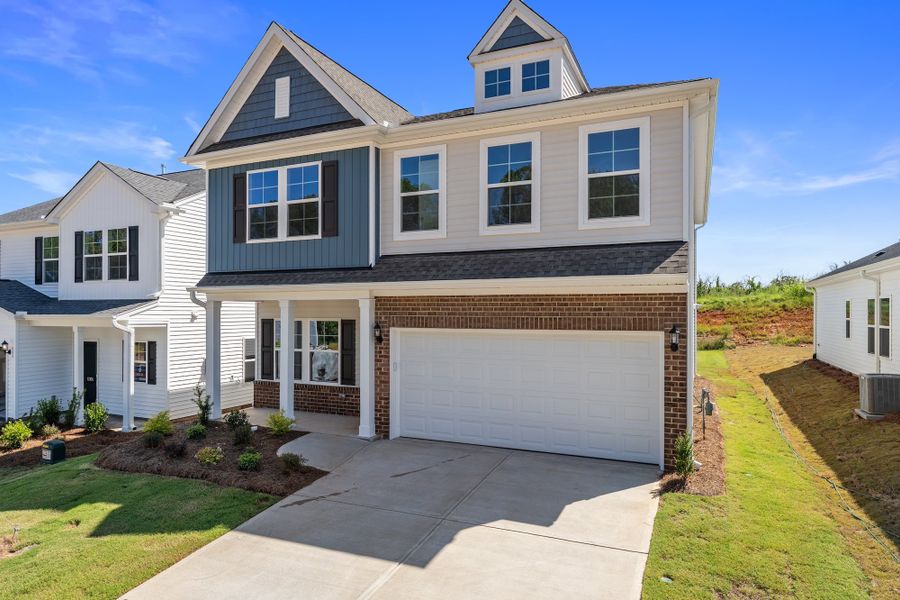 Front exterior of a new home in Richmond Hill, Inman, SC, highlighting curb appeal (Image 2). Front exterior of a new home in Richmond Hill, Inman, SC, highlighting curb appeal (Image 2).