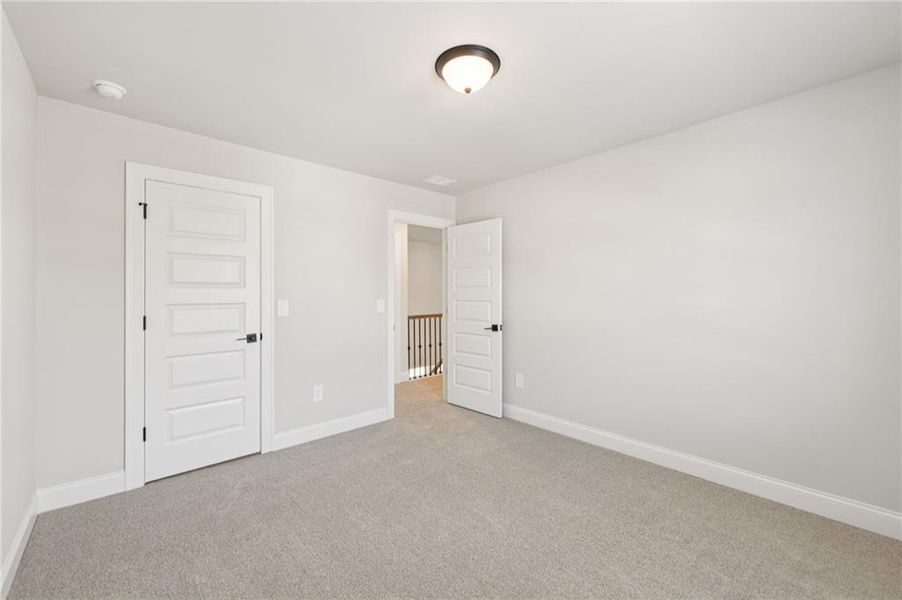 Spacious, unfurnished interior of a new home in Vines at Mill Creek - Estate Series, Braselton (Image 54).
