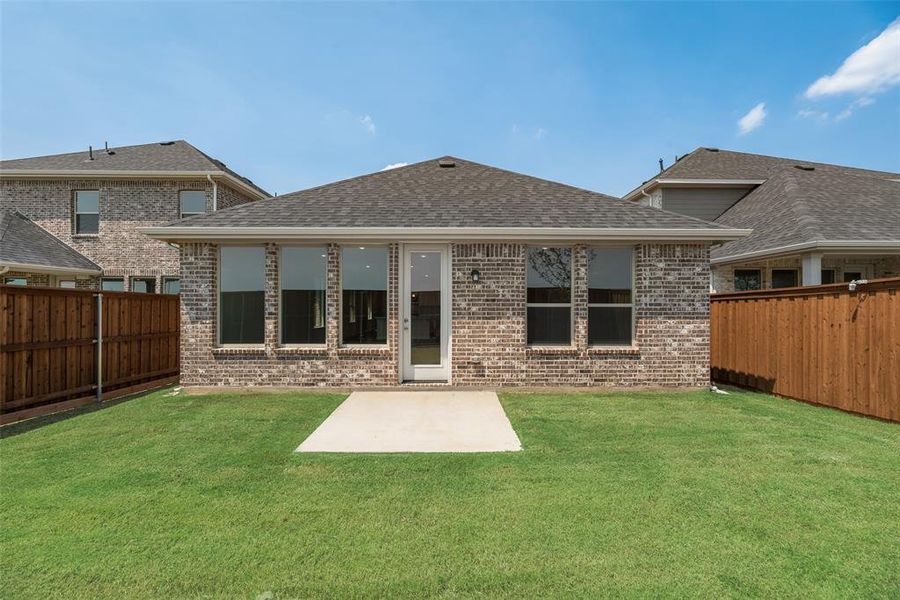 Front exterior of a new home in Spiritas Ranch, Little Elm, TX, highlighting curb appeal (Image 21). Front exterior of a new home in Spiritas Ranch, Little Elm, TX, highlighting curb appeal (Image 21).