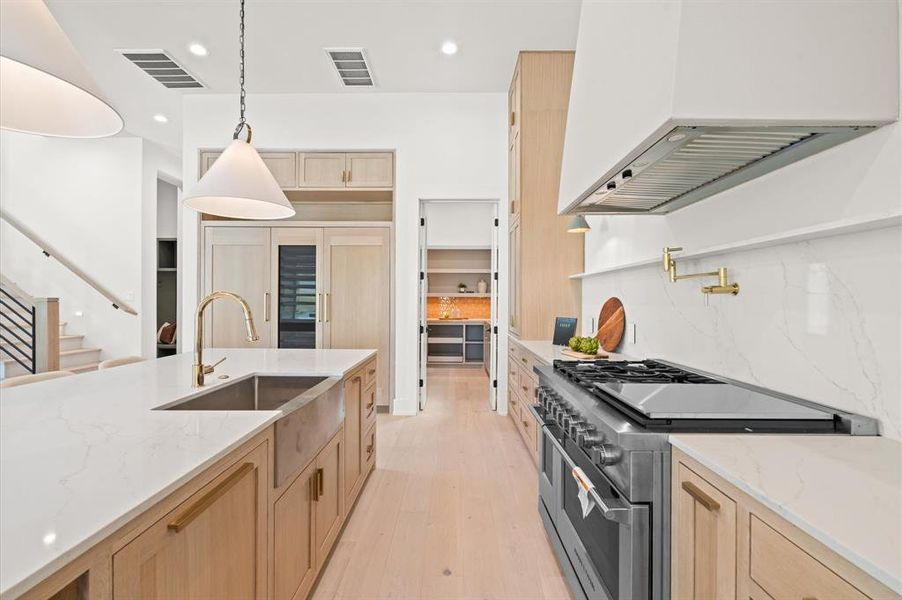 Massive kitchen with 48"  Fisher & Paykel oven/cooktop & warming oven. Previous TOMO Homes project.