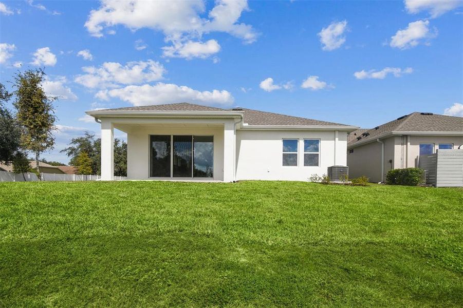 Exterior details and patio area of a home in The Peninsula at Rhodine Lake, Riverview (Image 20).