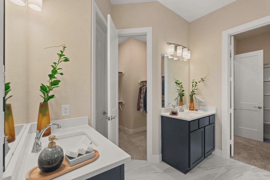 Representative furnished interior of a home built from the Marion by Chesmar Homes in Sunterra, Katy (Image 11).