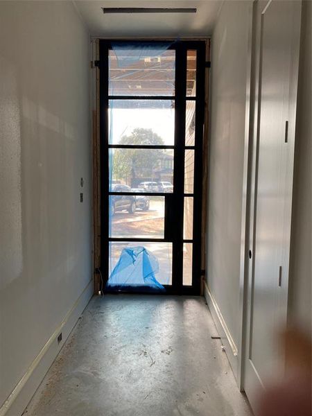 Interior 7' Hallway wit closet and door entry from garage