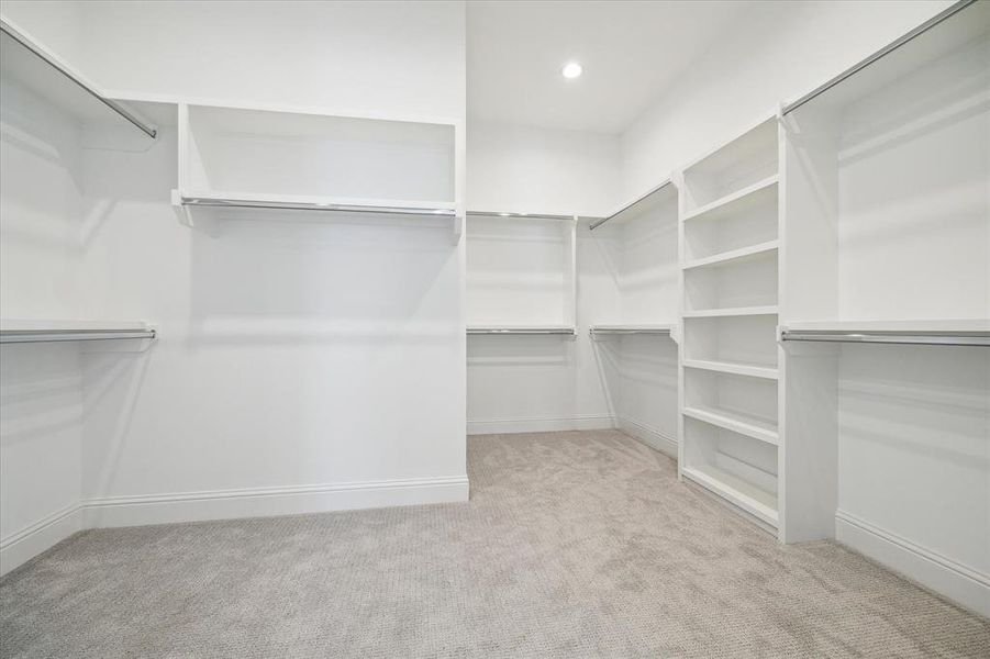 AMAZING CUSTOM Primary Closet with so many built-ins.