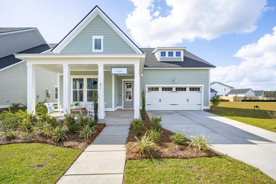Front exterior of a new home in Limehouse Farms: Arbor Collection, Summerville, SC, highlighting curb appeal (Image 1). Front exterior of a new home in Limehouse Farms: Arbor Collection, Summerville, SC, highlighting curb appeal (Image 1).