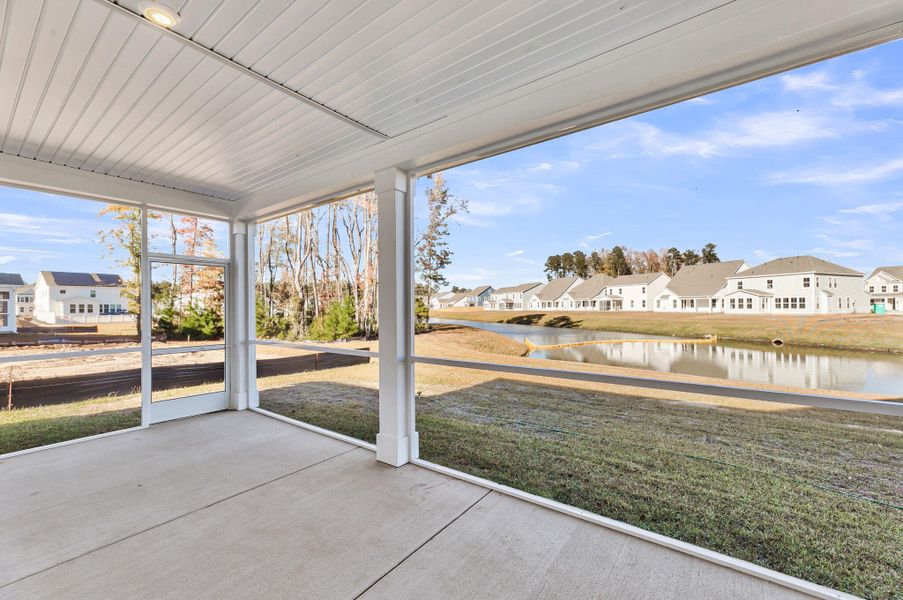 Exterior details and patio area of a home in Tidewater at Lakes of Cane Bay, Summerville (Image 2).