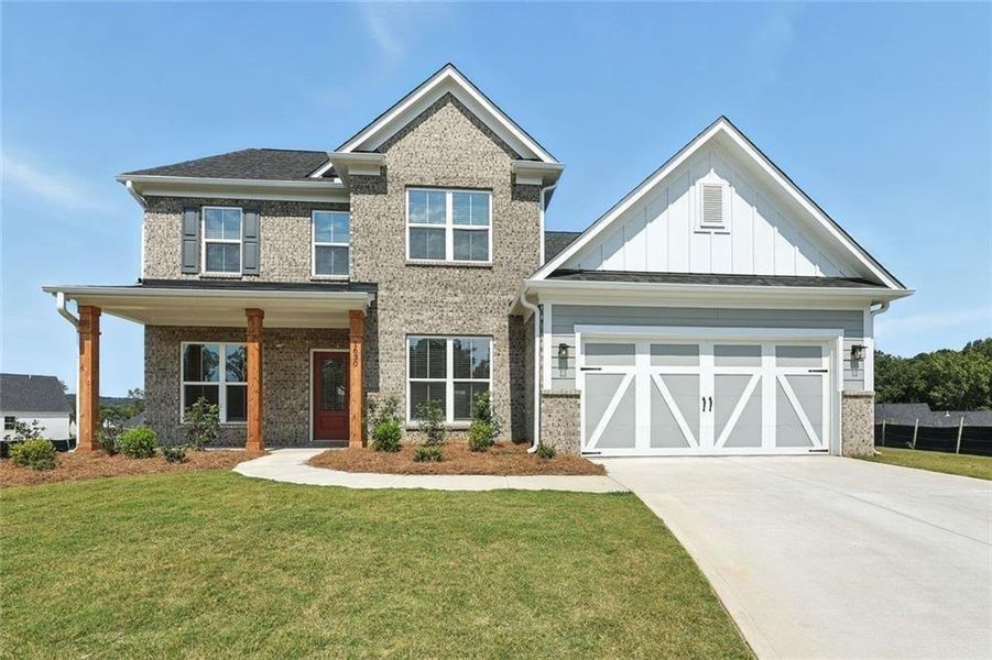Front exterior of a new home in Berkeley Mill, Cumming, GA, highlighting curb appeal (Image 21). Front exterior of a new home in Berkeley Mill, Cumming, GA, highlighting curb appeal (Image 21).