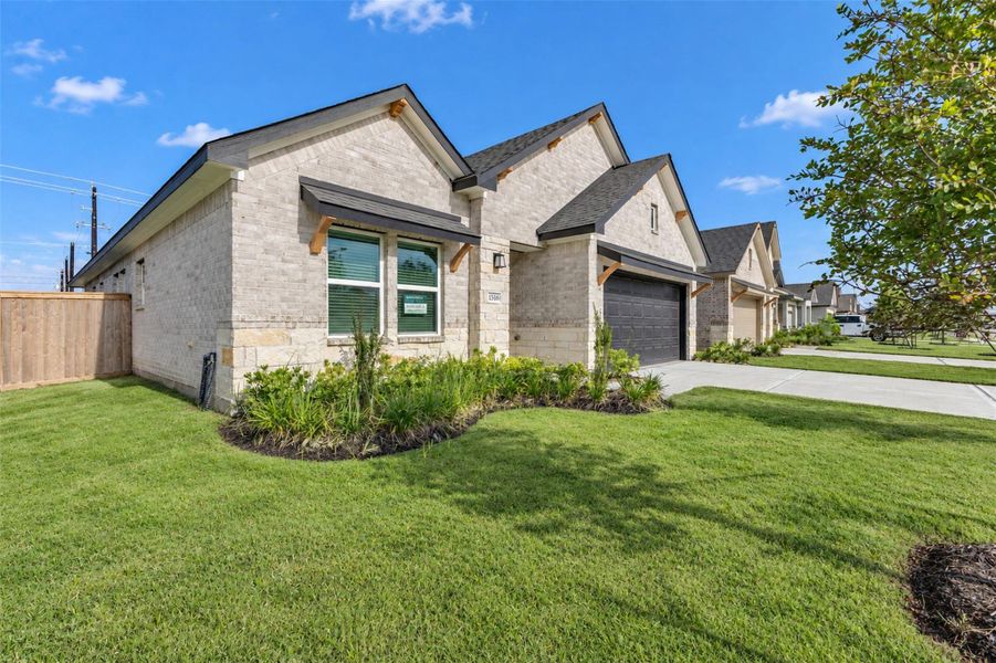 Front exterior of a new home in , Angleton, TX, highlighting curb appeal (Image 25).