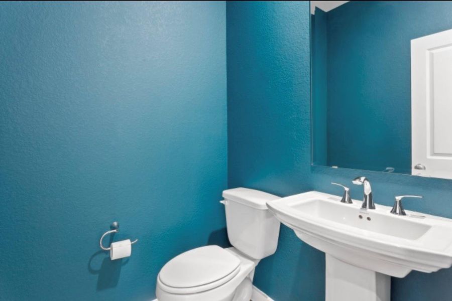 Convenient powder room located just off the entry foyer for guest. Convenient powder room located just off the entry foyer for guest.