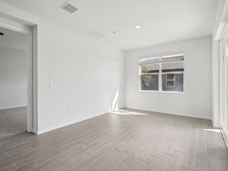 Spacious, unfurnished interior of a new home in Coasterra - Reserve Series, Palmetto (Image 11).