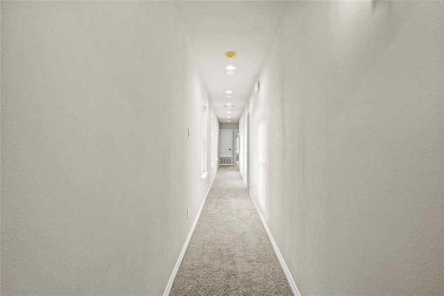 Hallway with light carpet