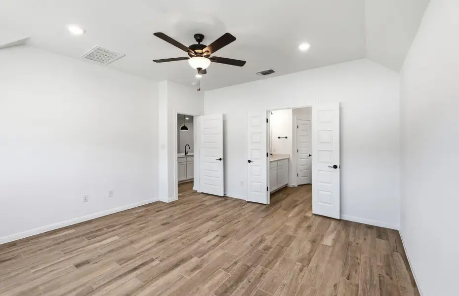 Spacious, unfurnished interior of a new home in West Cypress Hills, Spicewood (Image 22).
