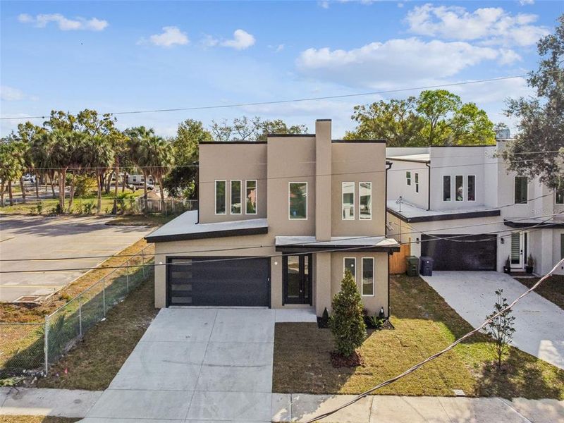 Front exterior of a new home in , Tampa, FL, highlighting curb appeal (Image 38).