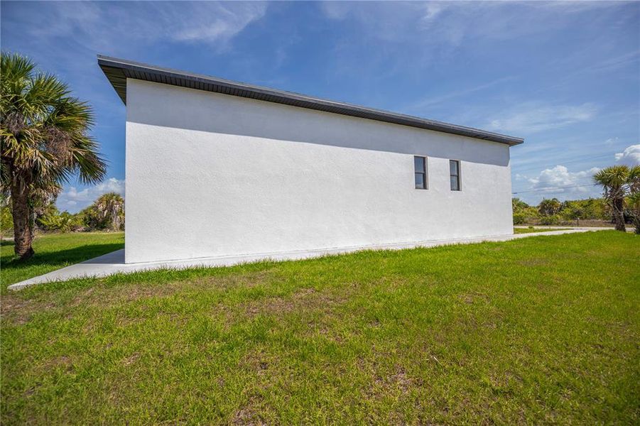 Exterior details and patio area of a home in , Port Charlotte (Image 32).