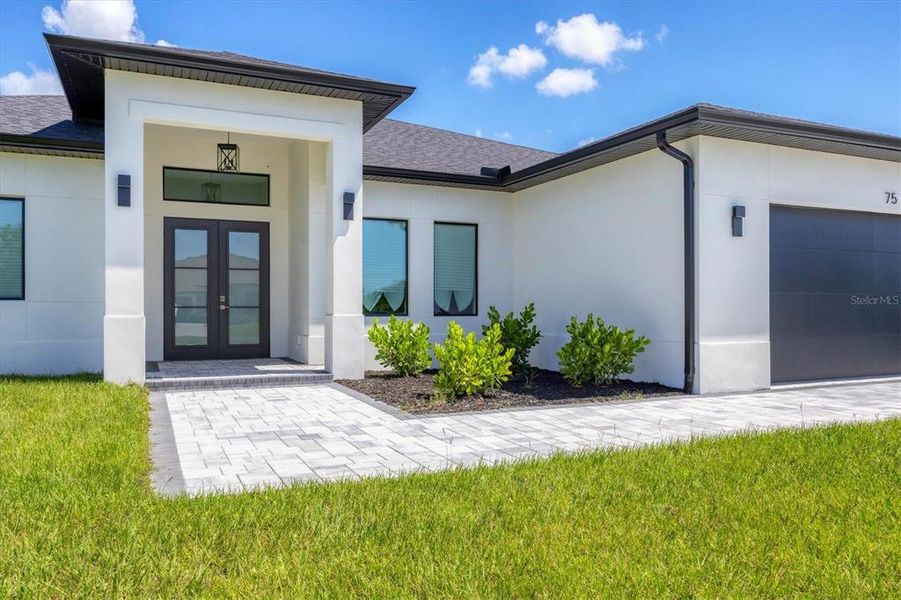Front exterior of a new home in , Rotonda West, FL, highlighting curb appeal (Image 24).