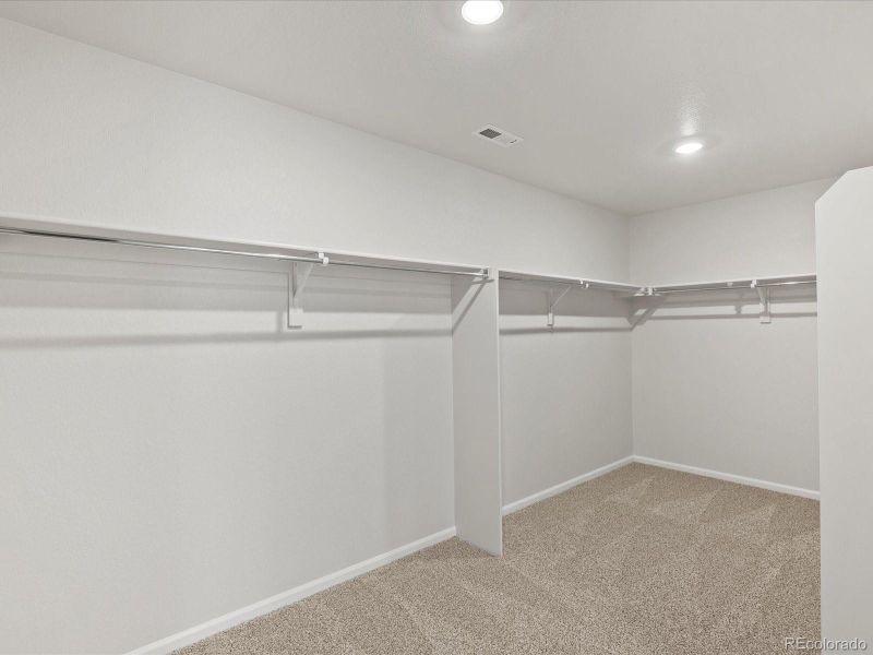 Spacious, unfurnished interior of a new home in Ridgeline Vista: The Flora Collection, Brighton (Image 32). Spacious, unfurnished interior of a new home in Ridgeline Vista: The Flora Collection, Brighton (Image 32).