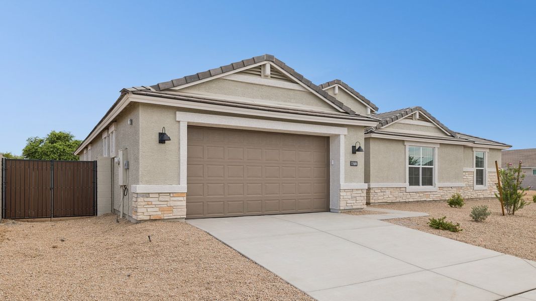 Front exterior of a new home in Zanjero Pass, Waddell, AZ, highlighting curb appeal (Image 24).