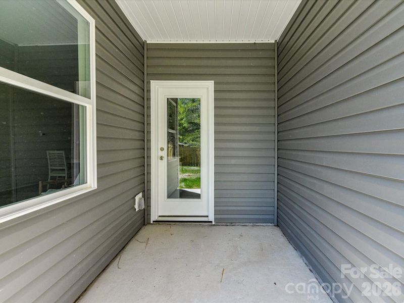 Covered patio offering a private outdoor retreat with easy access to a fenced backyard, perfect for relaxing or entertaining. Covered patio offering a private outdoor retreat with easy access to a fenced backyard, perfect for relaxing or entertaining.