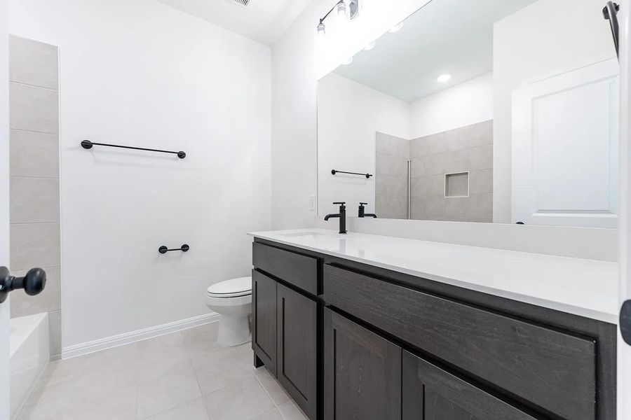 Furnished interior view inside a new home in Parmer Ranch 60, Georgetown (Image 8).