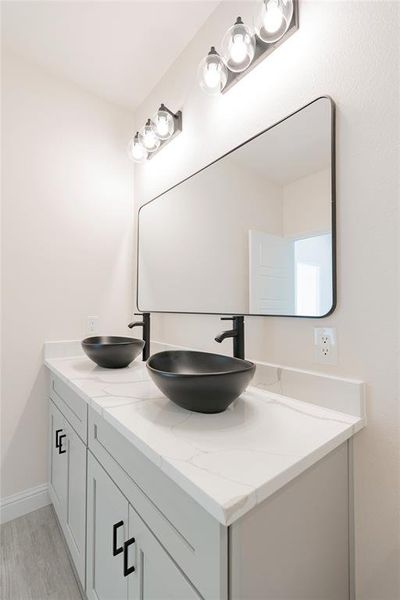 Bathroom featuring vanity and hardwood / wood-style flooring