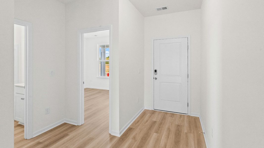 A bright, simple hallway connecting the Easton’s secondary bedrooms for easy daily flow A bright, simple hallway connecting the Easton’s secondary bedrooms for easy daily flow
