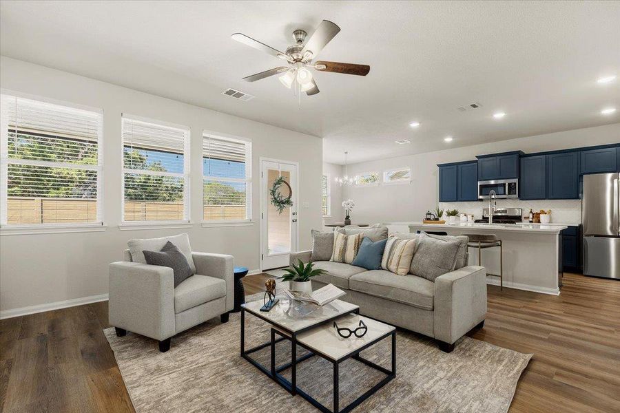 Windows line the rear wall of the home, taking advantage of every opportunity for a view.