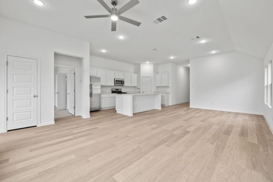 Living and Dining Area in the Quartz home plan by Trophy Signature Homes – REPRESENTATIVE PHOTO