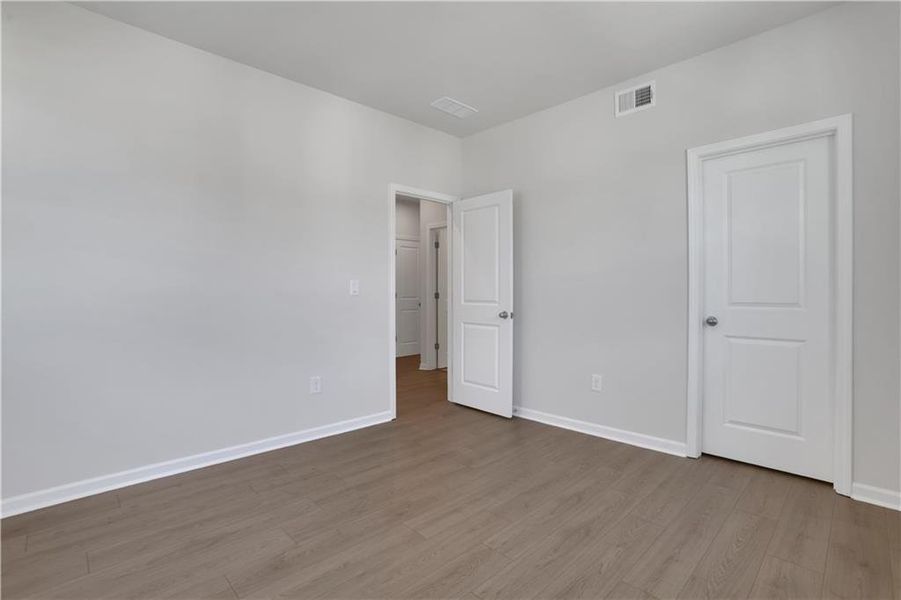 Spacious, unfurnished interior of a new home in The Paddocks at Doc Hughes, Buford (Image 28).