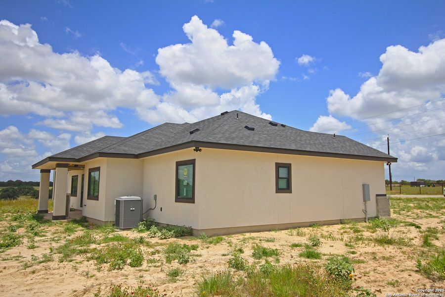 Front exterior of a new home in , La Vernia, TX, highlighting curb appeal (Image 23).