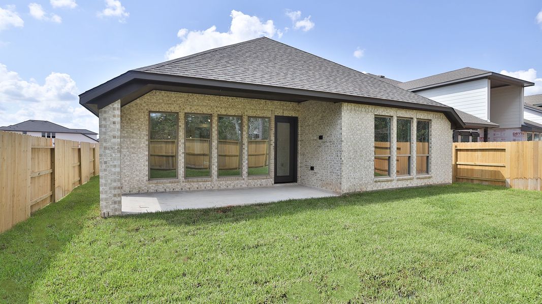 Exterior details and patio area of a home in Grand Central Park, Conroe (Image 3).