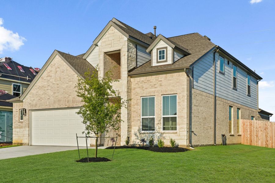 Front exterior of a new home in Beacon Hill, Waller, TX, highlighting curb appeal (Image 21). Front exterior of a new home in Beacon Hill, Waller, TX, highlighting curb appeal (Image 21).