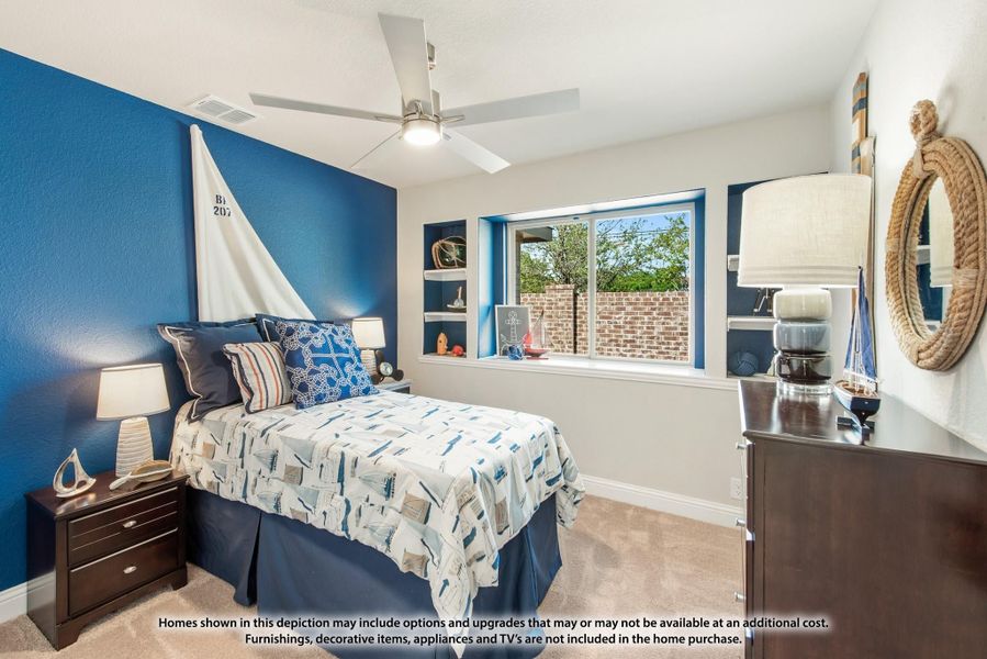 Bedroom with blue accent wall, ceiling fan, built-in shelves, and nautical decor theme Bedroom with blue accent wall, ceiling fan, built-in shelves, and nautical decor theme