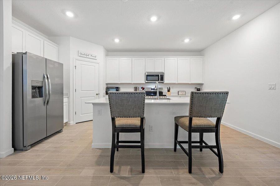 Furnished interior view inside a new home in Edenbrooke at Hyland Trail | 55+, Green Cove Springs (Image 5).