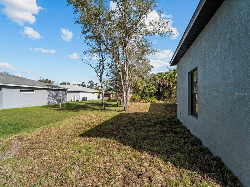 Exterior details and patio area of a home in , North Port (Image 34).