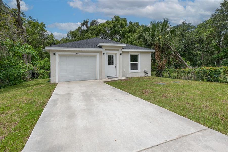 Front exterior of a new home in , Deland, FL, highlighting curb appeal (Image 22).