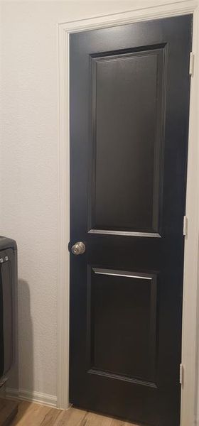 Doorway from laundry room that goes into master closet for convenience.