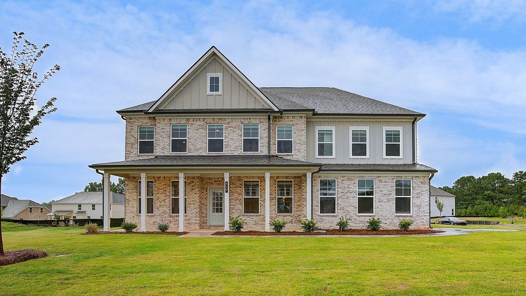Representative exterior photo of a completed home built from the Stonefield by DRB Homes in Westwind Estates, Hampton, GA (Image 20).