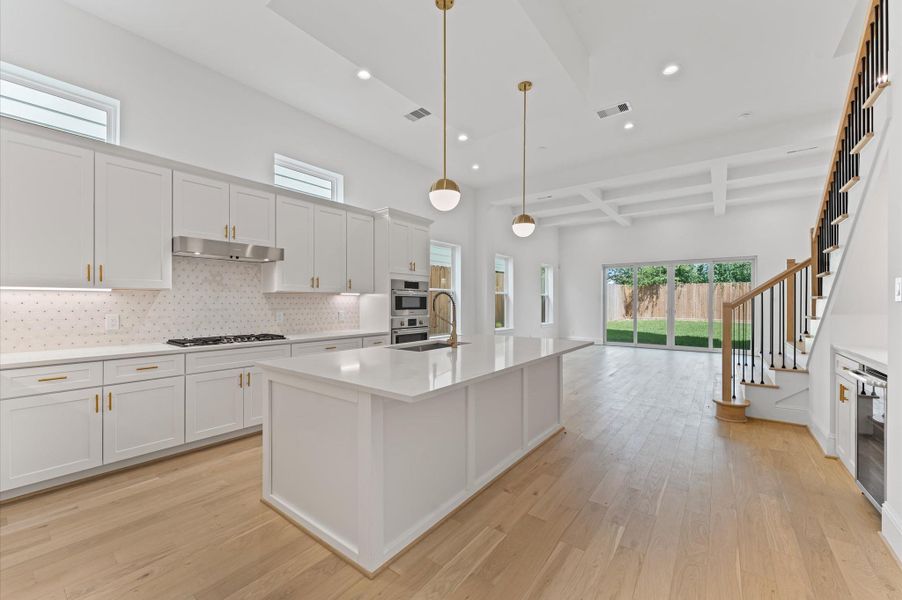 Kitchen, dining and living areas. *Previous Brownstone Living project, selections and floor plans may vary.*