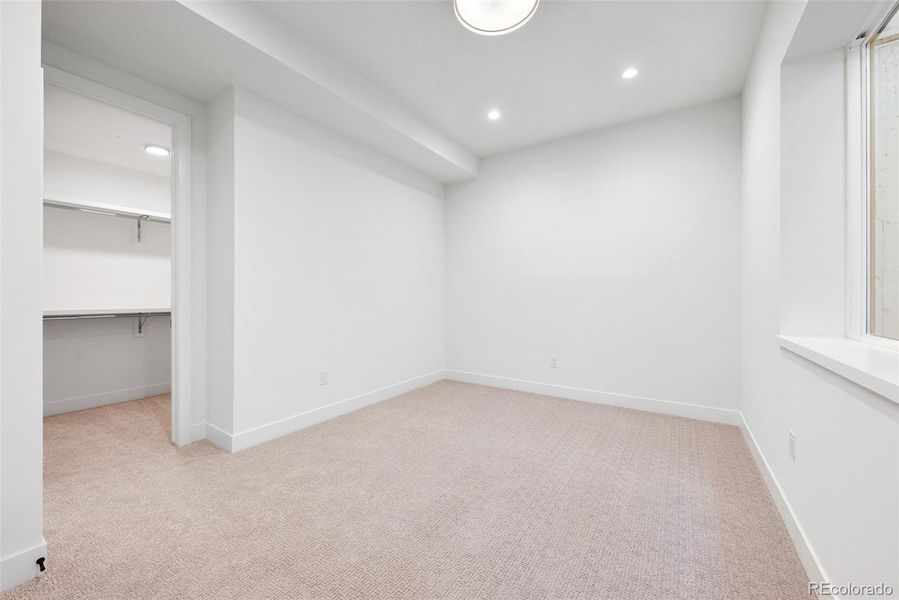 Lower level bedroom (5th bedroom) with private en suite bath