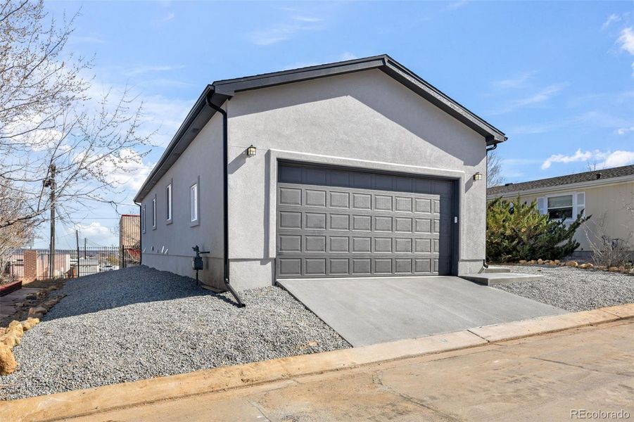 Front exterior of a new home in , Colorado Springs, CO, highlighting curb appeal (Image 30).