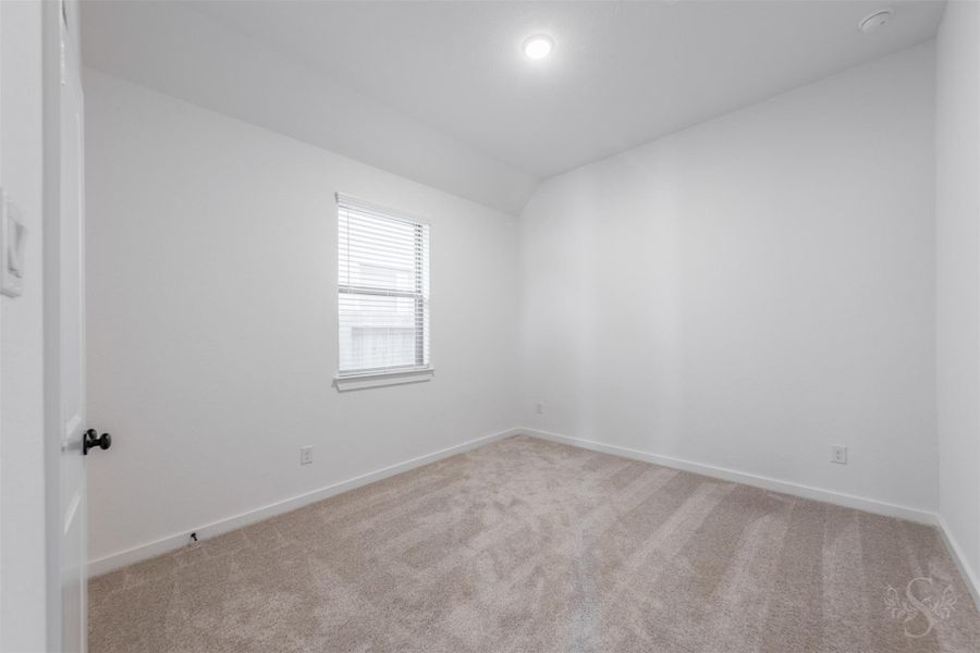 This generously sized secondary bedroom features soft carpeting, a neutral palette, and a large window that brightens the space with natural light. A perfect blank slate, it’s ready to be personalized for guests, kids, or a home office. This generously sized secondary bedroom features soft carpeting, a neutral palette, and a large window that brightens the space with natural light. A perfect blank slate, it’s ready to be personalized for guests, kids, or a home office.