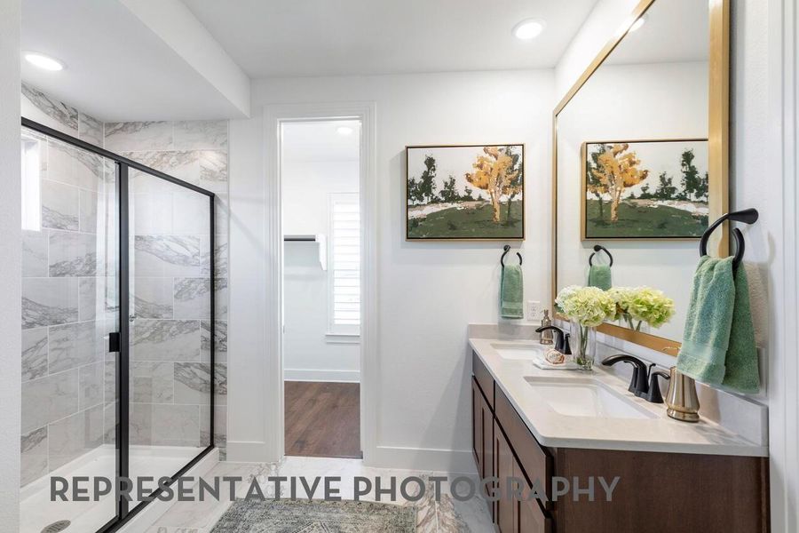 primary bathroom with a shower and window brings in natural light, creating a bright and refreshing space.