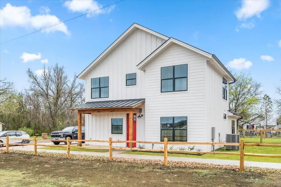 Front exterior of a new home in , Johnson City, TX, highlighting curb appeal (Image 1).