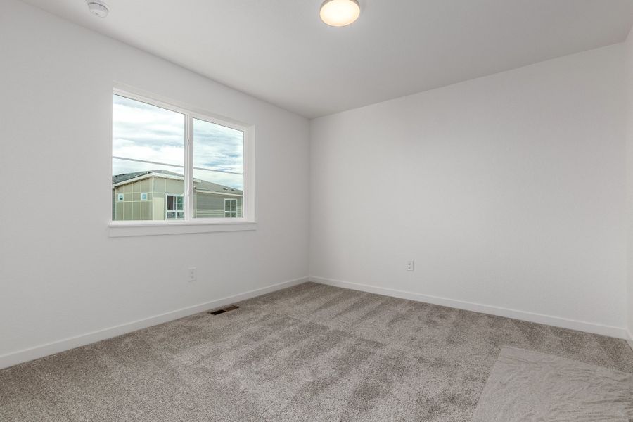 Spacious, unfurnished interior of a new home in The Commons at Victory Ridge, Colorado Springs (Image 22).