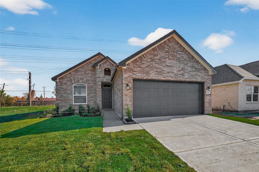 Front exterior of a new home in Rollingbrook Estates, Baytown, TX, highlighting curb appeal (Image 25).