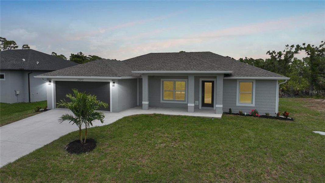 Front exterior of a new home in , Port Charlotte, FL, highlighting curb appeal (Image 21). Front exterior of a new home in , Port Charlotte, FL, highlighting curb appeal (Image 21).