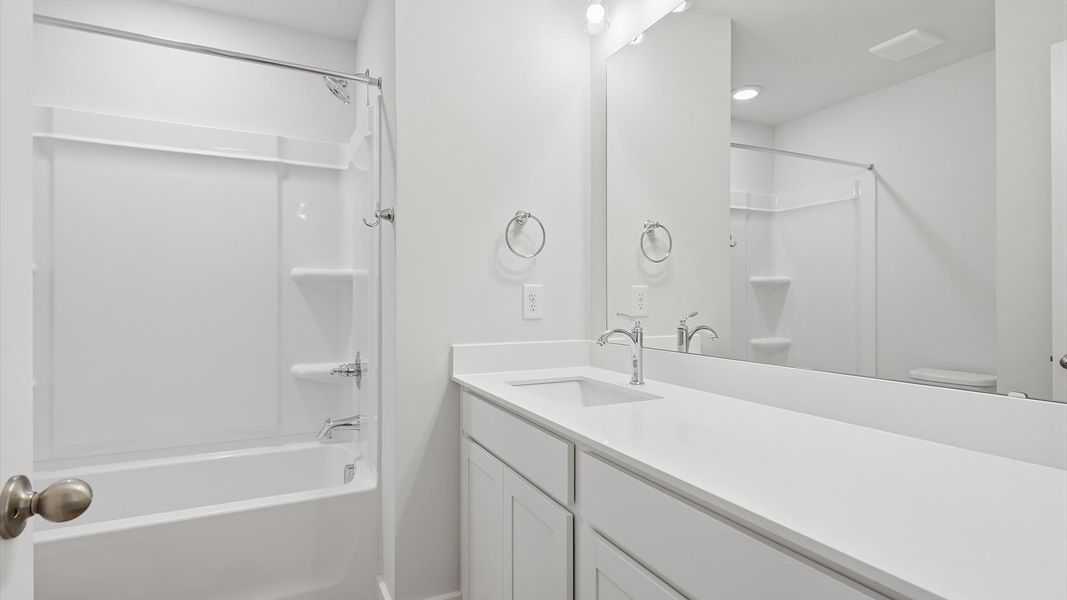 Accomplished bathroom design with sleek tile, high-quality cabinetry, and refined hardware near Downtown Greer Accomplished bathroom design with sleek tile, high-quality cabinetry, and refined hardware near Downtown Greer