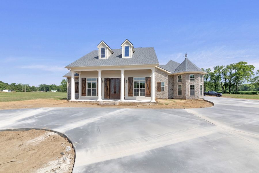 Representative exterior photo of a completed home built from the The Lafitte by Manuel Builders in Chapel Bend, Montgomery, TX (Image 22).